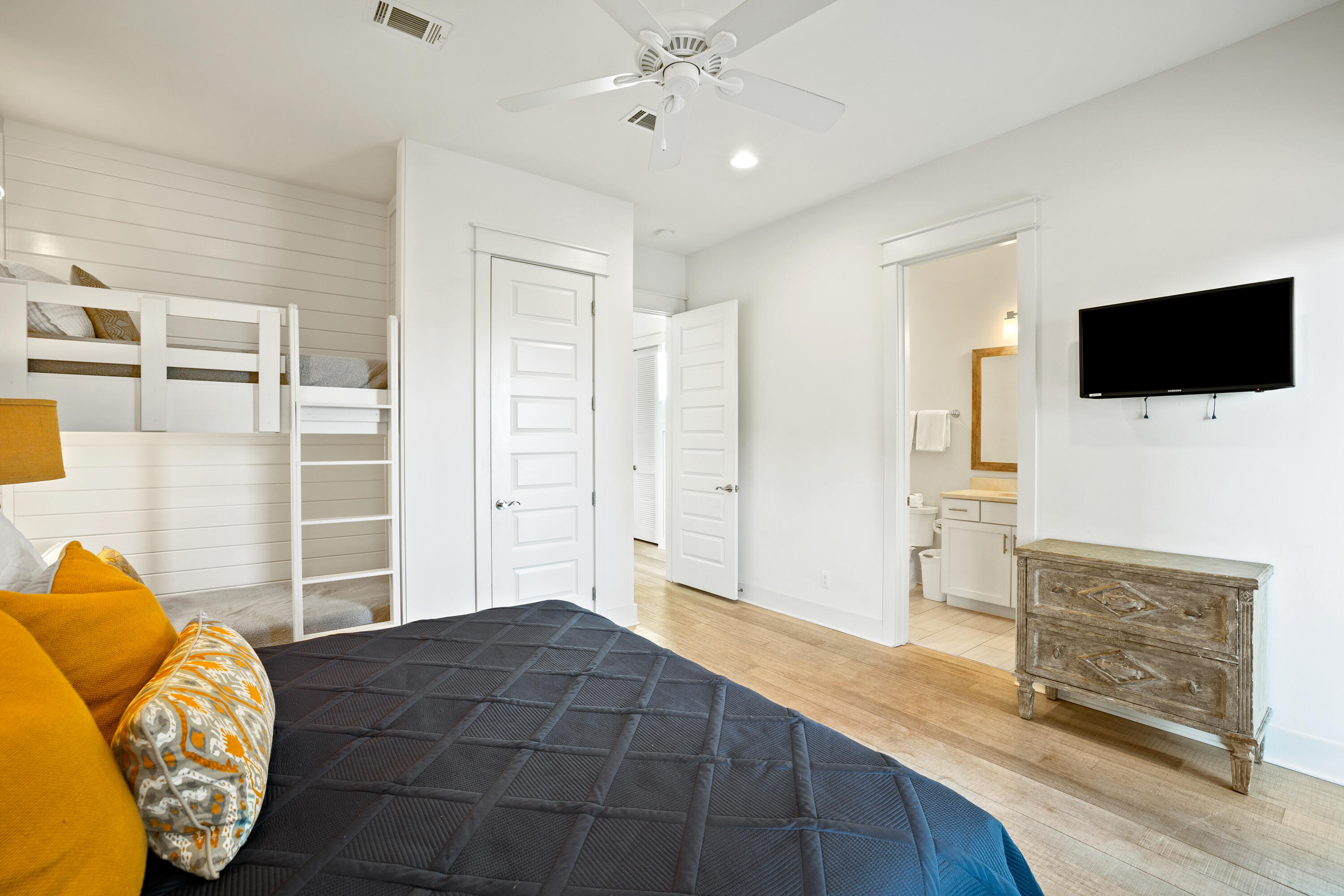 114 South Wall Street Inlet Beach, FL 32461 - Photo 41 of 62 a bedroom with a bed and a flat screen tv