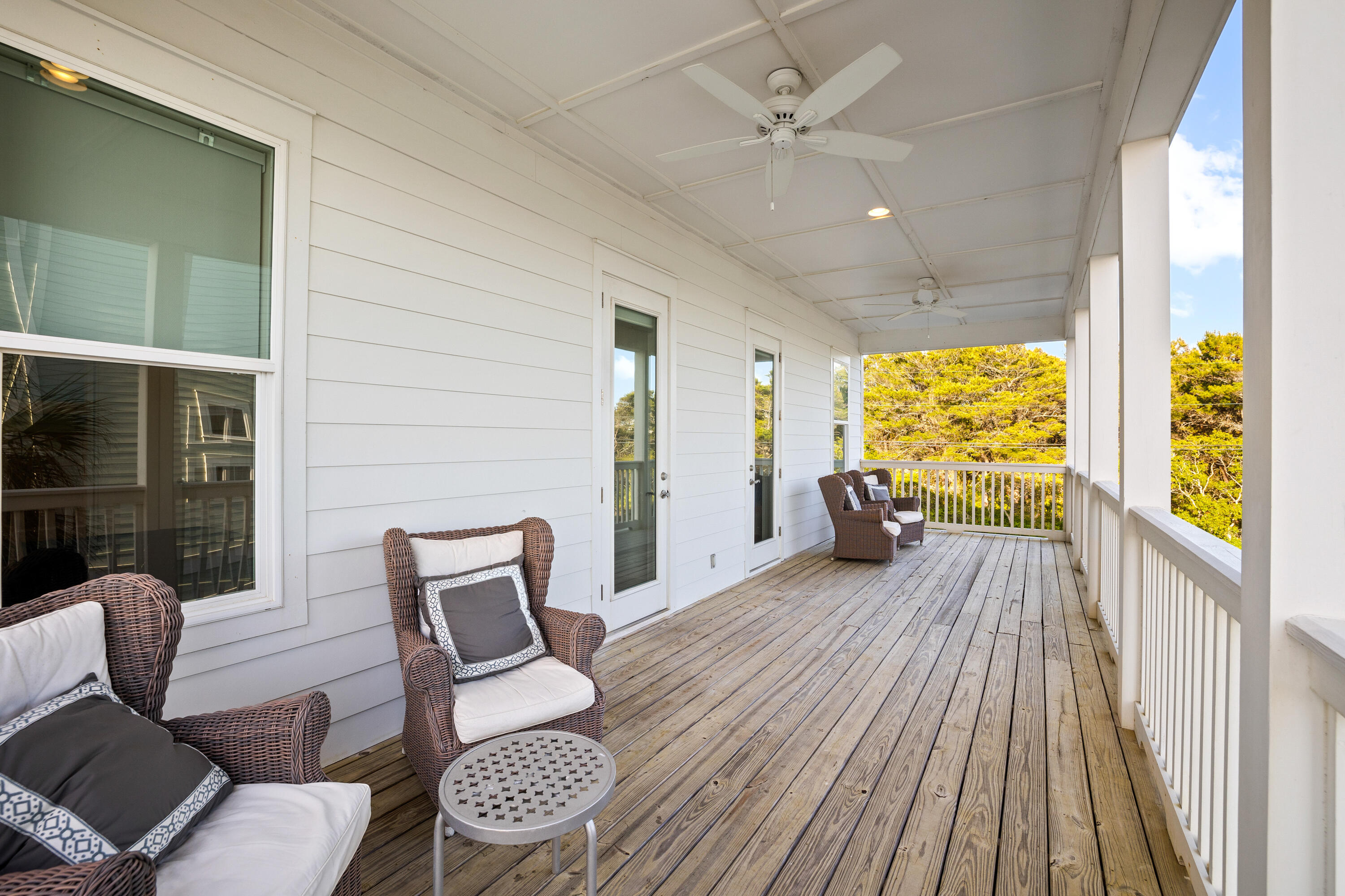 114 South Wall Street Inlet Beach, FL 32461 - Photo 44 of 62 a view of two chairs in the balcony with wooden floor
