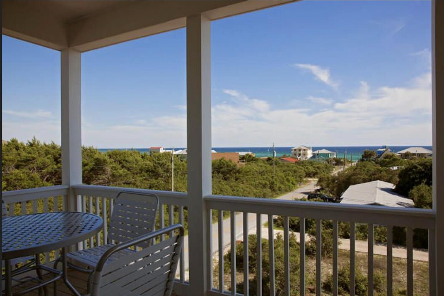 114 South Wall Street Inlet Beach, FL 32461 - Photo 56 of 62 a view of a balcony with wooden chairs