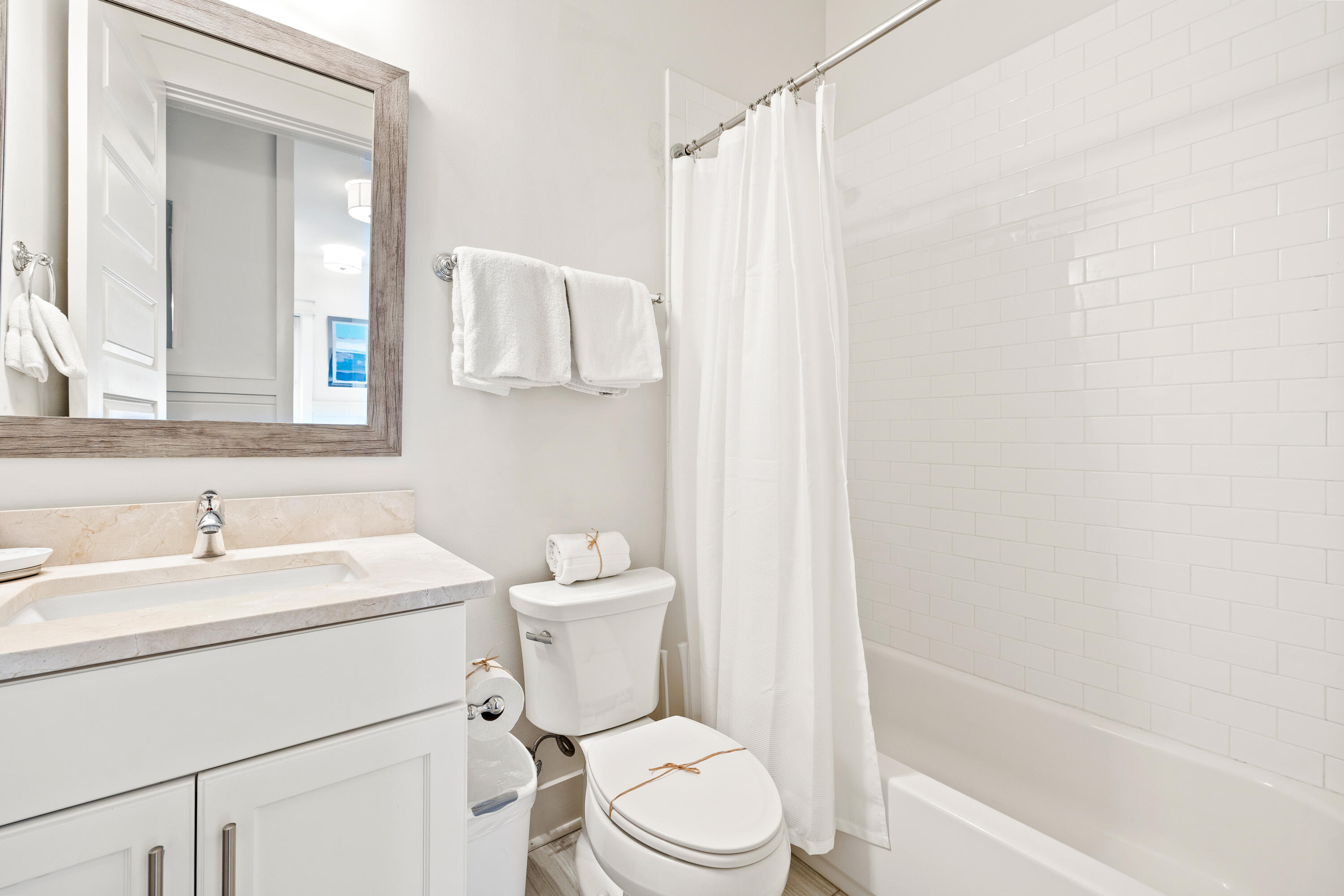 114 South Wall Street Inlet Beach, FL 32461 - Photo 62 of 62 a white toilet sitting next to a bathroom sink