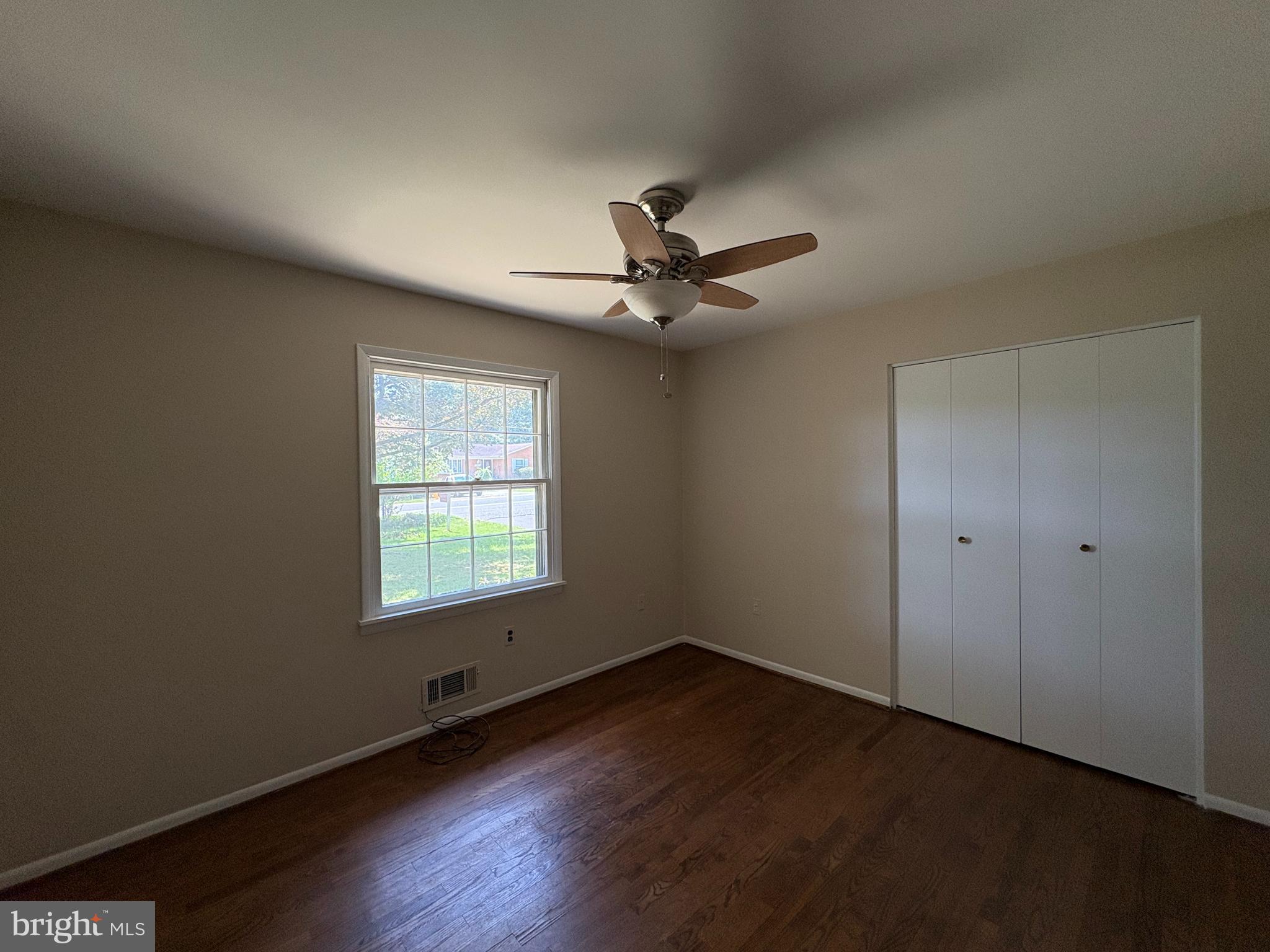 1554 Long Point Road Pasadena, MD 21122 - Photo 16 of 27 a view of a room with wooden floor and windows