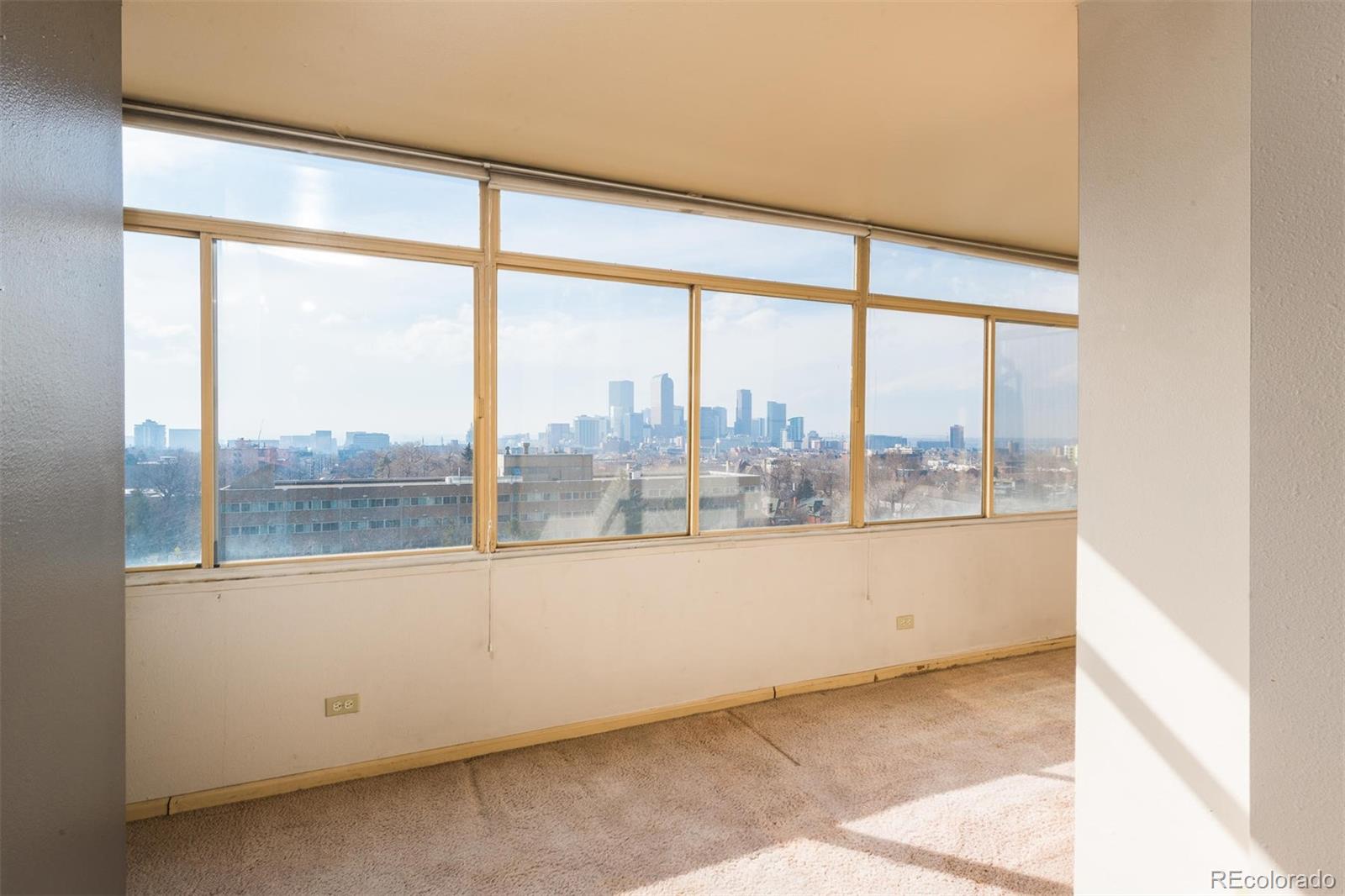 1313 North Williams Street, Unit 906 Denver, CO 80218 - Photo 11 of 31 a view of an empty room with a large window