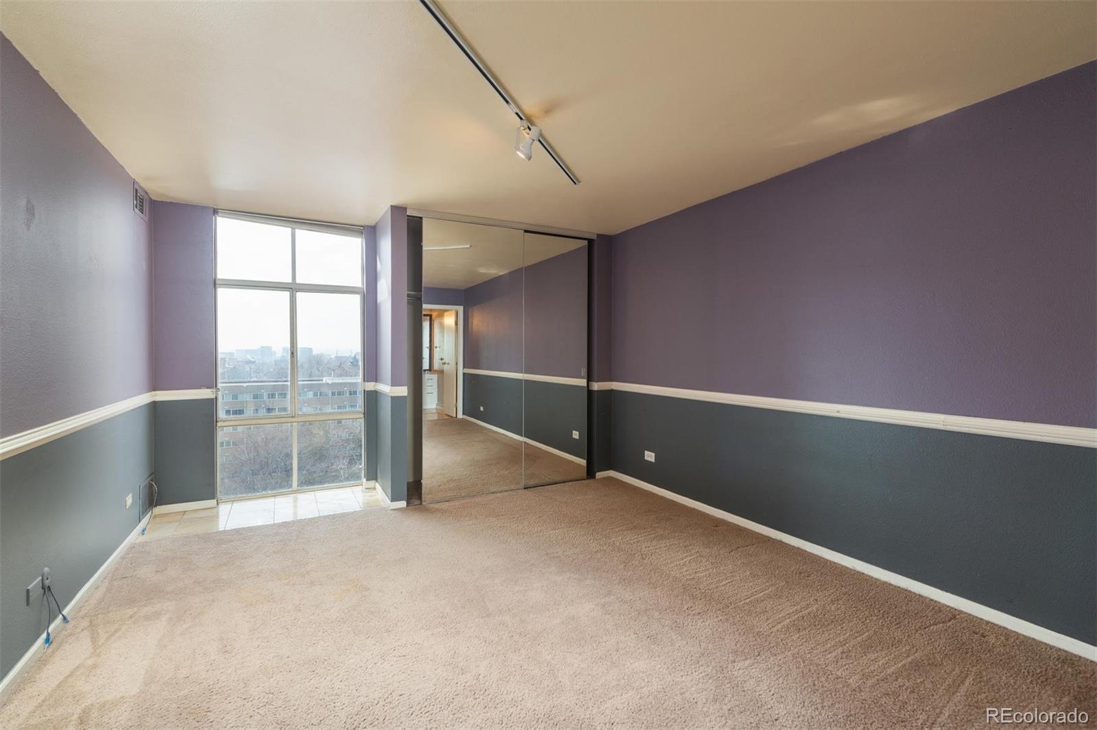 1313 North Williams Street, Unit 906 Denver, CO 80218 - Photo 19 of 31 an empty room with sliding door