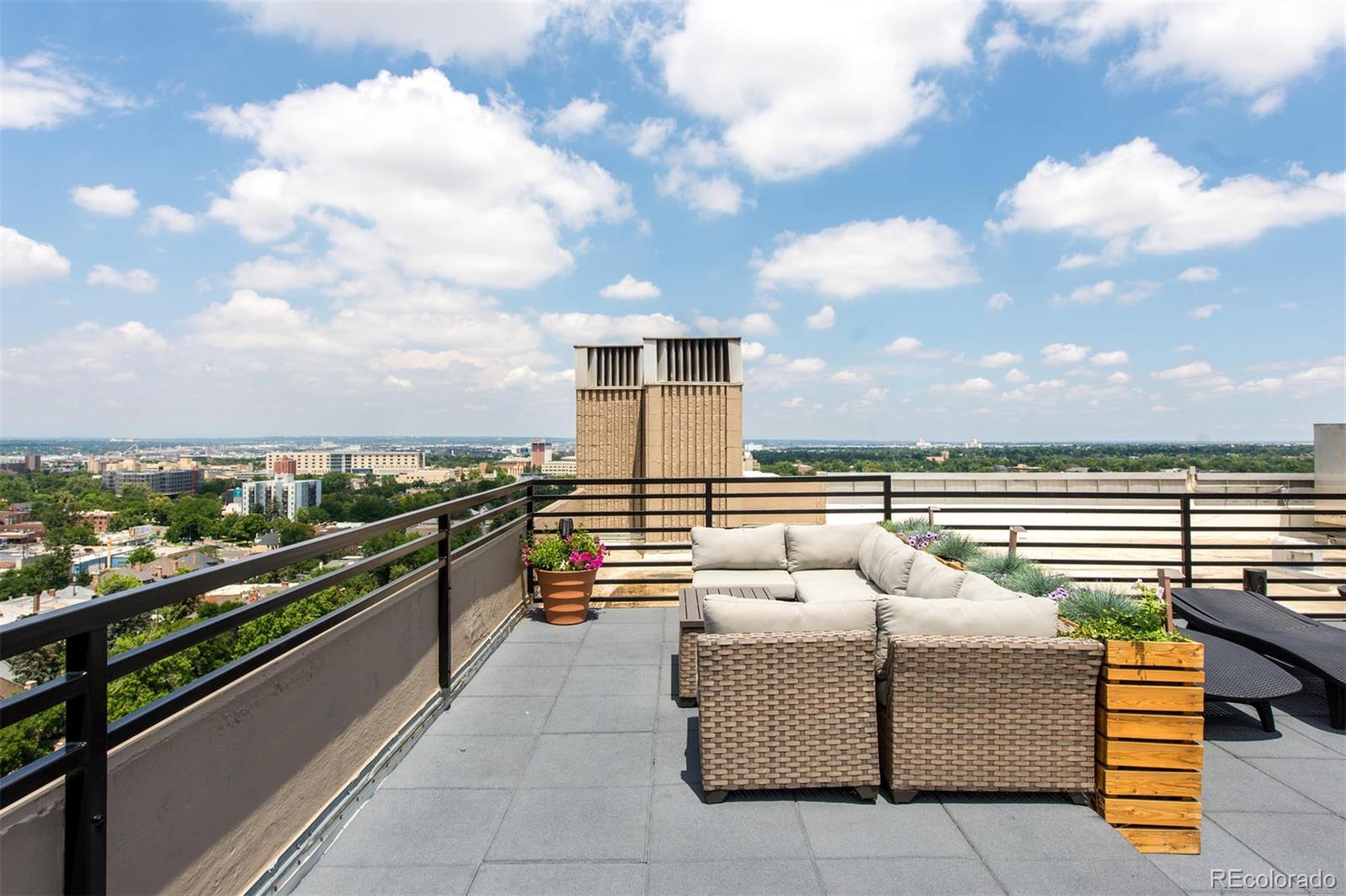 1313 North Williams Street, Unit 906 Denver, CO 80218 - Photo 28 of 31 a balcony with furniture and city view