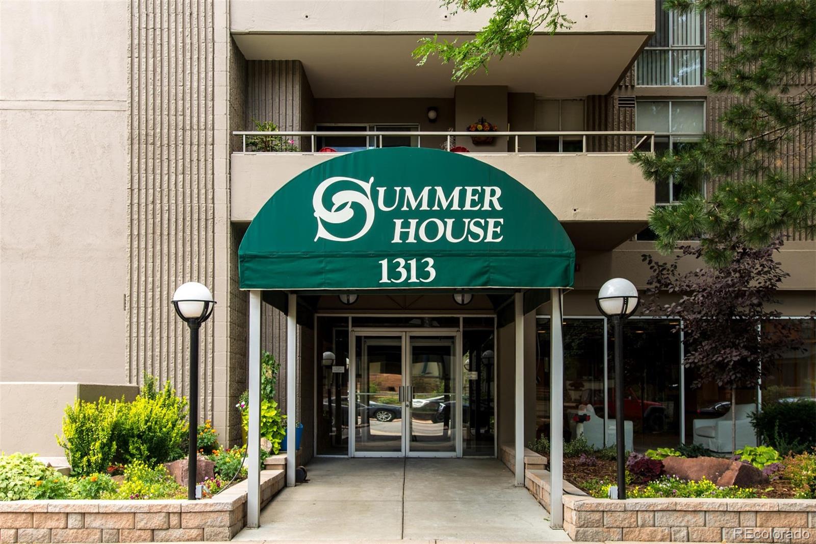 1313 North Williams Street, Unit 906 Denver, CO 80218 - Photo 3 of 31 a view of a shop with a couple of people and a signage