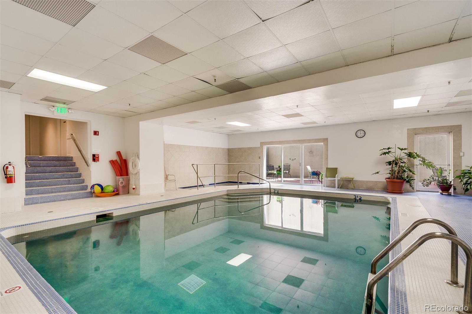1313 North Williams Street, Unit 906 Denver, CO 80218 - Photo 31 of 31 a kitchen with stainless steel appliances granite countertop a sink and a stove
