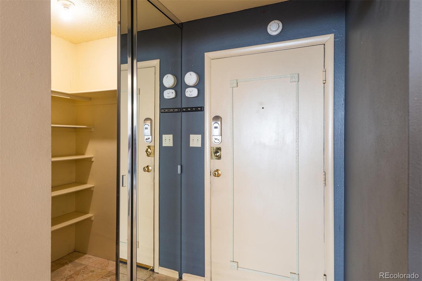 1313 North Williams Street, Unit 906 Denver, CO 80218 - Photo 5 of 31 a view of a hallway with wooden floor