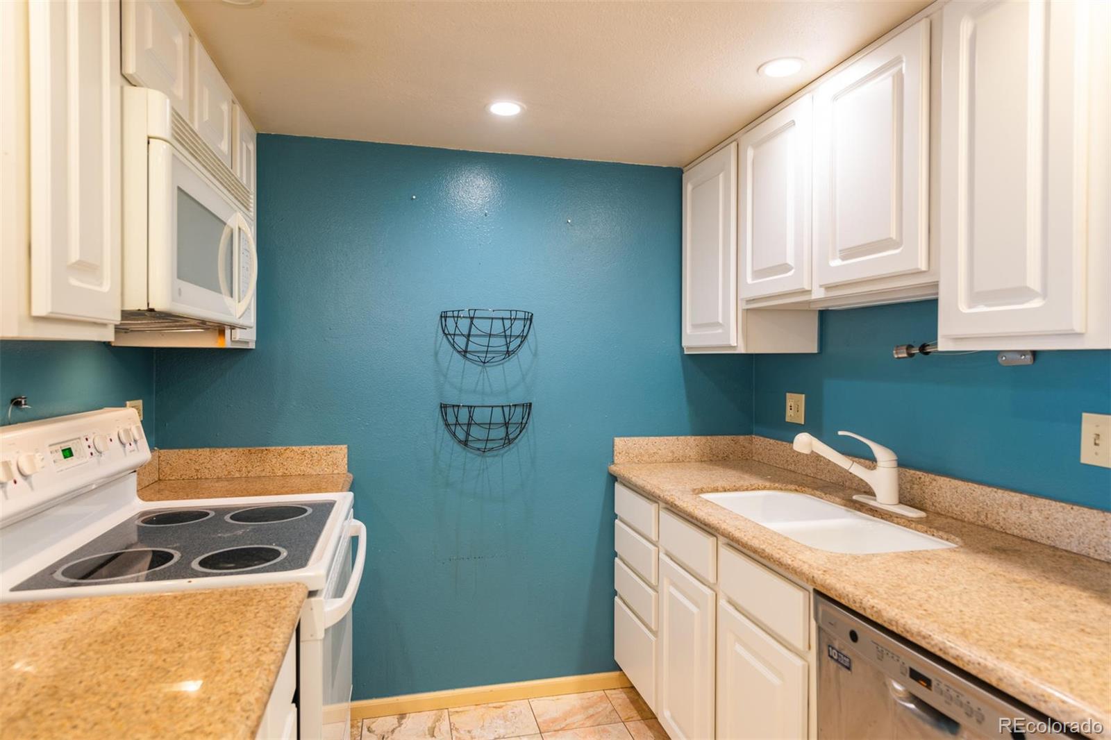 1313 North Williams Street, Unit 906 Denver, CO 80218 - Photo 8 of 31 a room with storage and utility