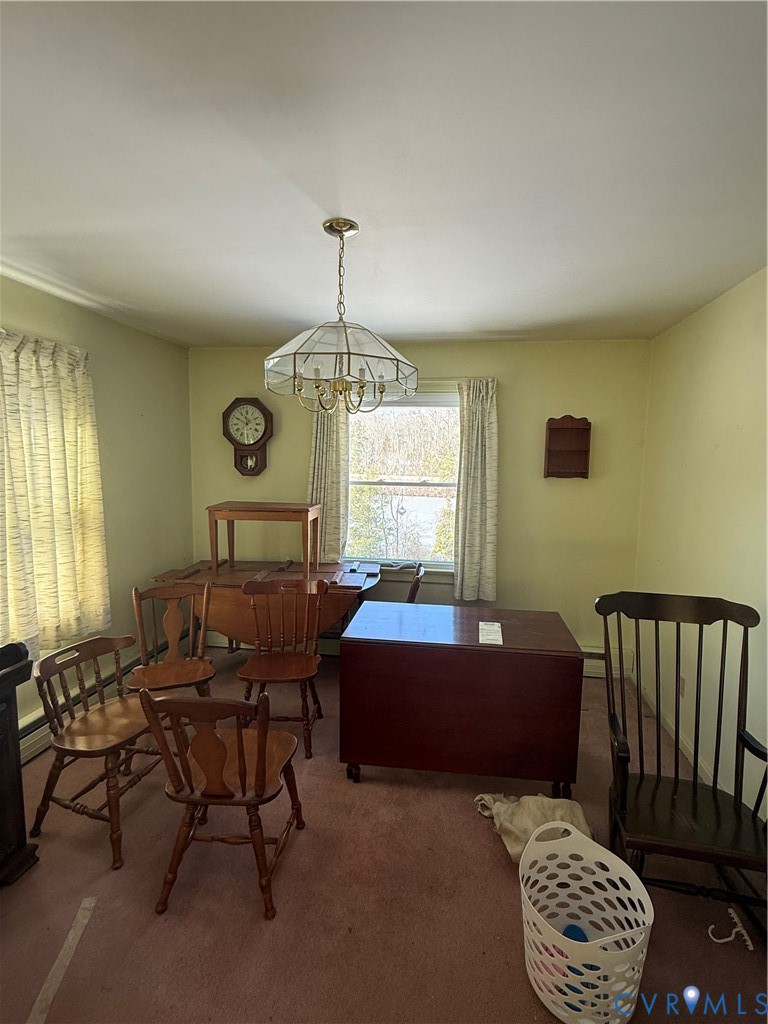 654 Scarlet Oak Road Richmond, VA 23235 - Photo 4 of 12 a living room with furniture chandelier and a window