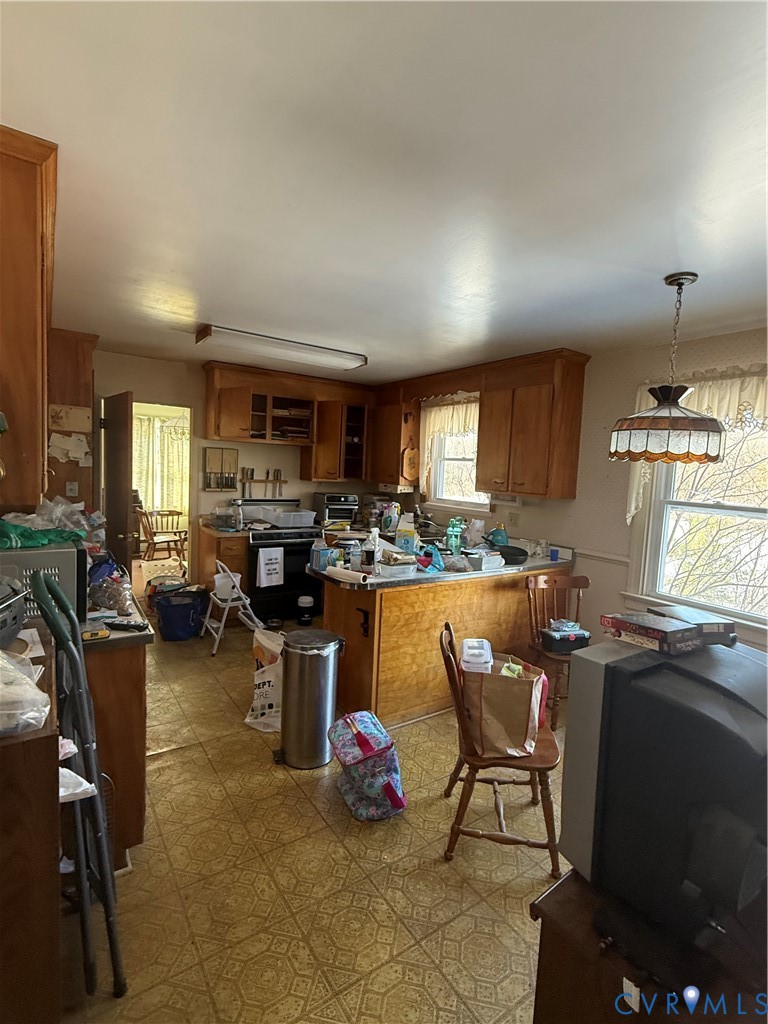 654 Scarlet Oak Road Richmond, VA 23235 - Photo 10 of 12 a living room with lots of furniture and a chandelier