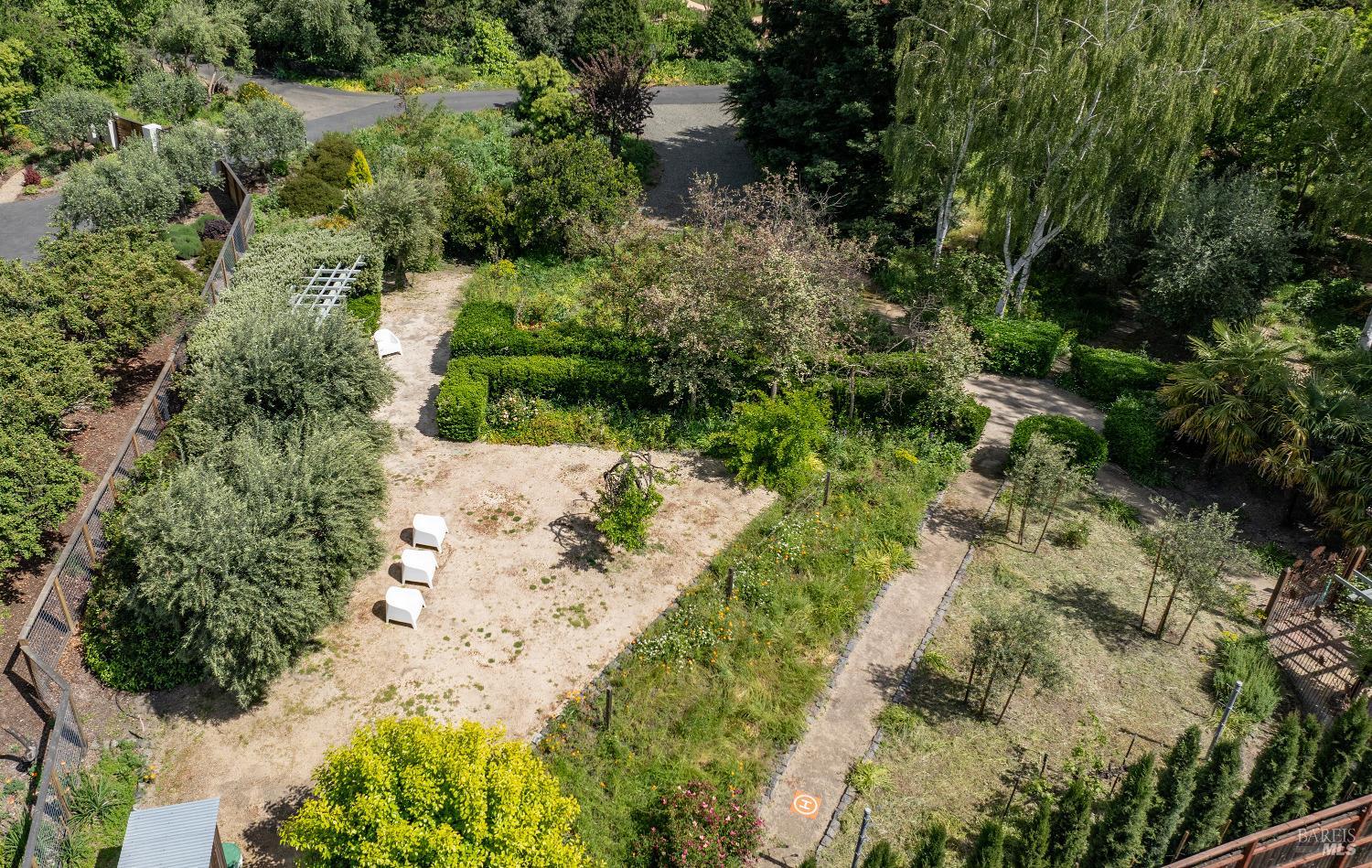 an aerial view of a yard with a house