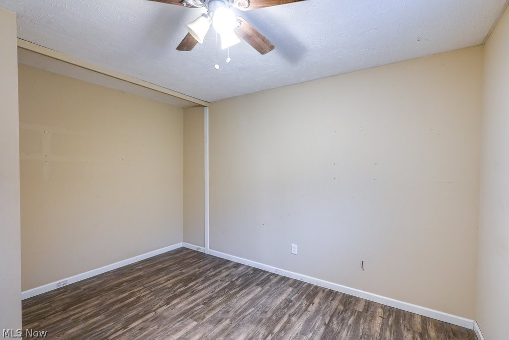 1481 Old Forge Road Mogadore, OH 44260 - Photo 27 of 27 Spare room with wood-type flooring, ceiling fan, and a textured ceiling