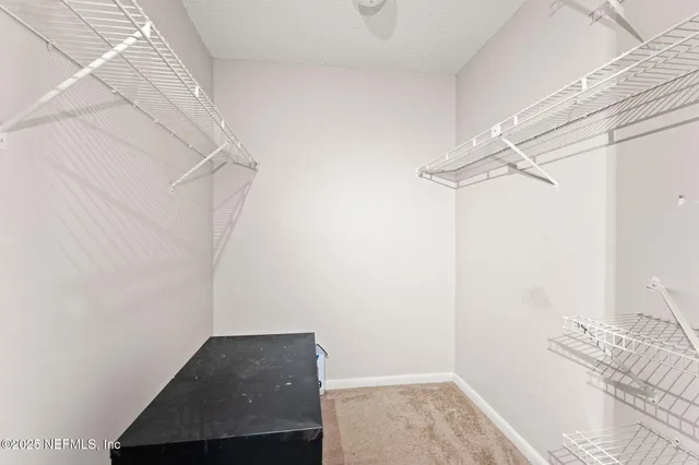 a view of small space with racks on the wall