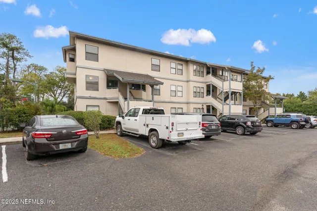 a view of street with parked cars