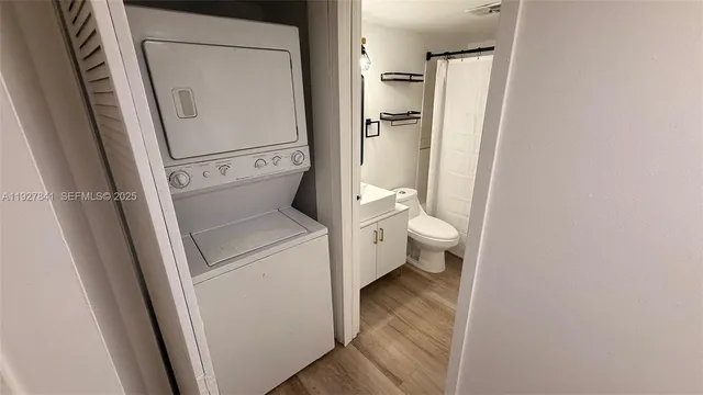 a view of bathroom with a toilet and a sink