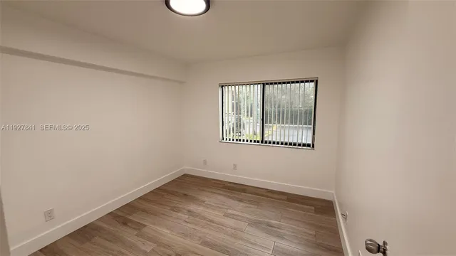 a bathroom with a sink mirror toilet and shower