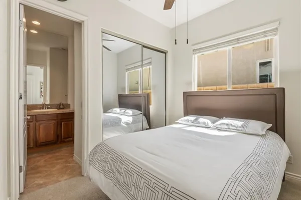 a bedroom with a bed and a view living room