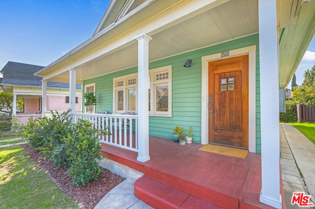 755 East Kensington Road Los Angeles, CA 90026 - Photo 2 of 25 a front view of a house with a yard