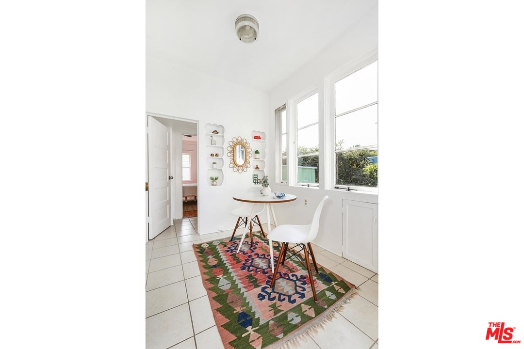 755 East Kensington Road Los Angeles, CA 90026 - Photo 13 of 25 a view of a dining room with furniture and window