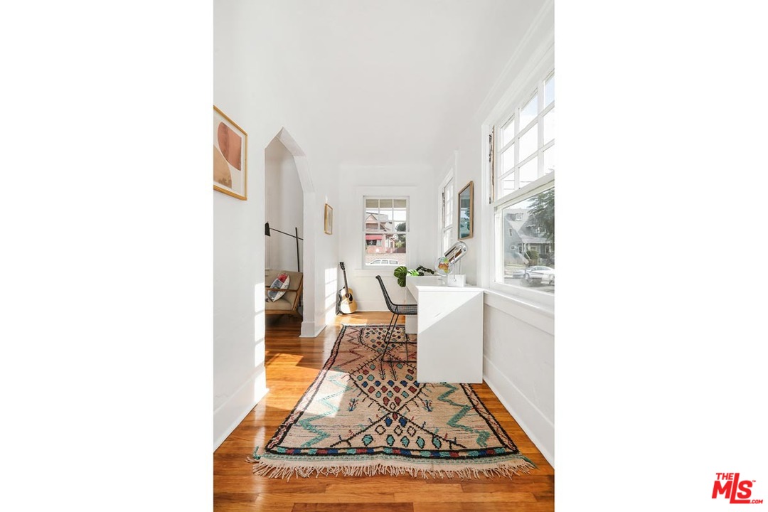 755 East Kensington Road Los Angeles, CA 90026 - Photo 14 of 25 a living room with furniture and a rug