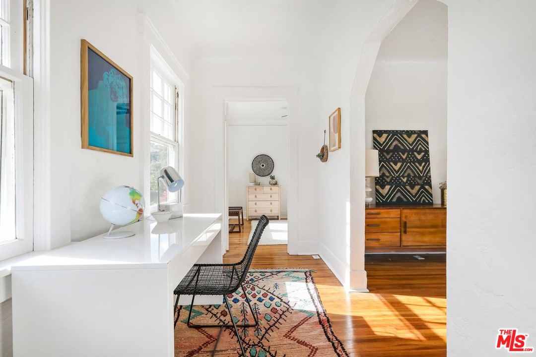 755 East Kensington Road Los Angeles, CA 90026 - Photo 15 of 25 a bathroom with a sink and a mirror