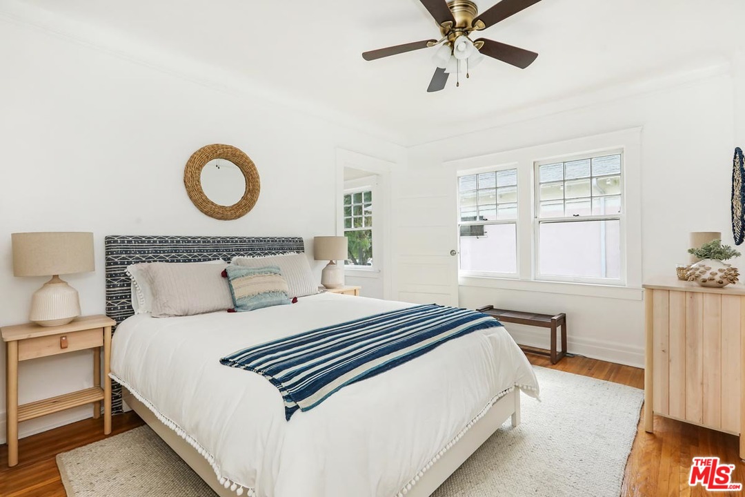 755 East Kensington Road Los Angeles, CA 90026 - Photo 16 of 25 a bedroom with a bed and window