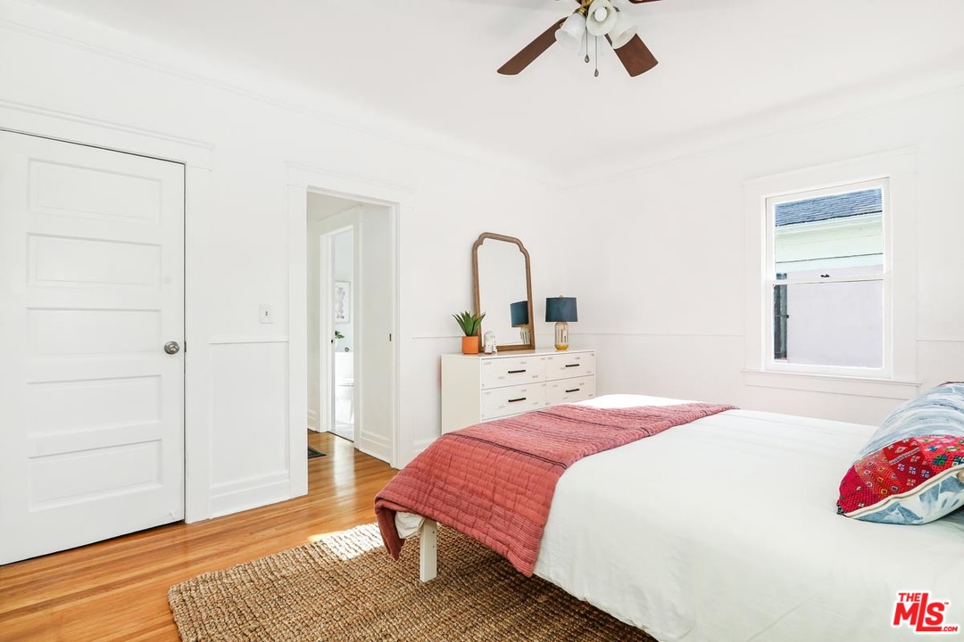 755 East Kensington Road Los Angeles, CA 90026 - Photo 21 of 25 a bedroom with a bed and a dresser