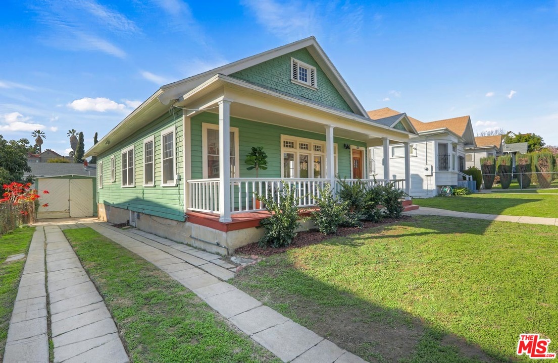 755 East Kensington Road Los Angeles, CA 90026 - Photo 25 of 25 a front view of a house with garden