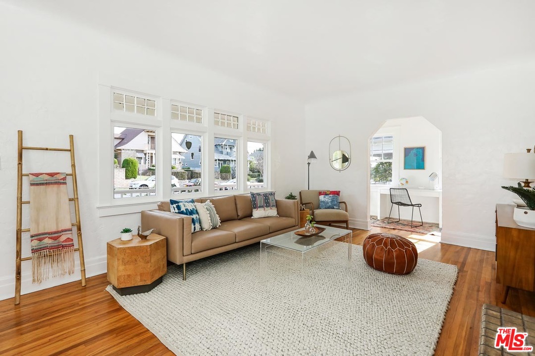 755 East Kensington Road Los Angeles, CA 90026 - Photo 5 of 25 a living room with furniture and a couch