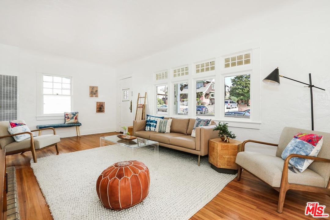 755 East Kensington Road Los Angeles, CA 90026 - Photo 6 of 25 a living room with furniture and a wooden floor