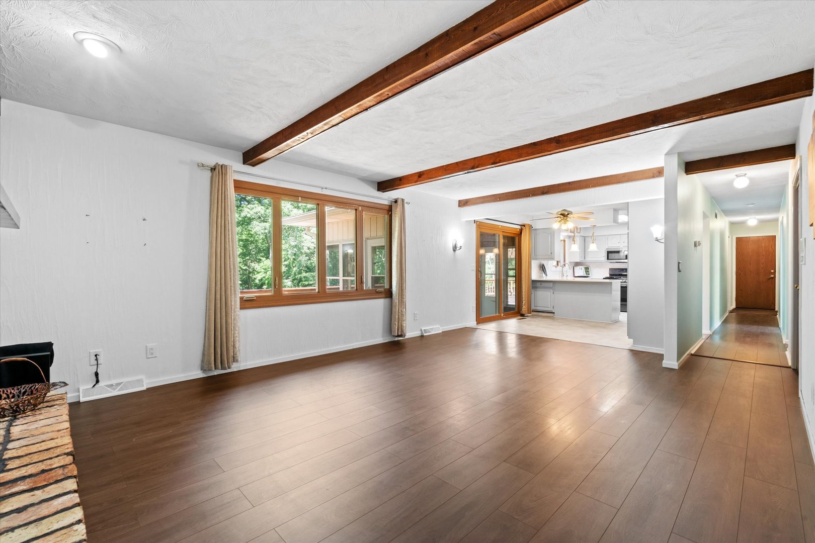 10 Oak Grove Road Geneseo, IL 61254 - Photo 7 of 43 a view of an empty room with wooden floor and a window