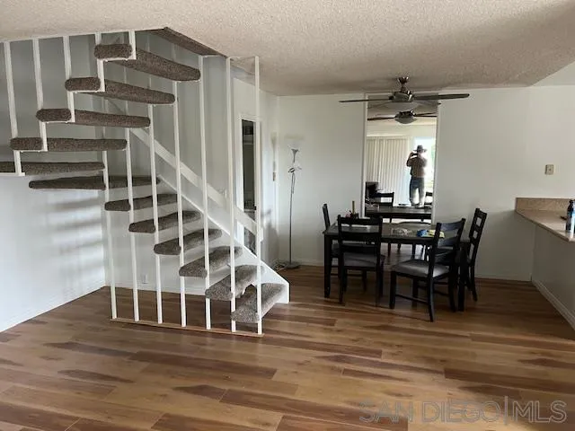 9564 Easter Way San Diego, CA 92121 - Photo 2 of 16 a view of a dining room with furniture and wooden floor