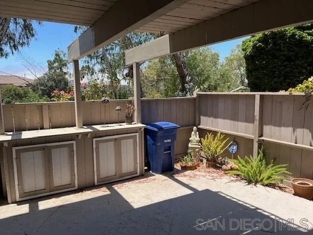 9564 Easter Way San Diego, CA 92121 - Photo 4 of 16 a view of a backyard with plants and a lake view