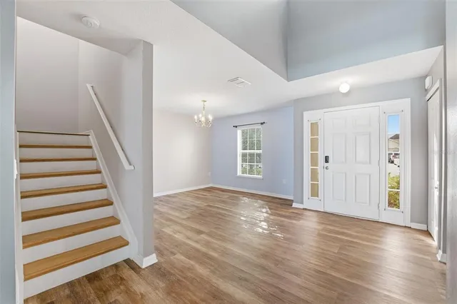 a view of entryway with wooden floor