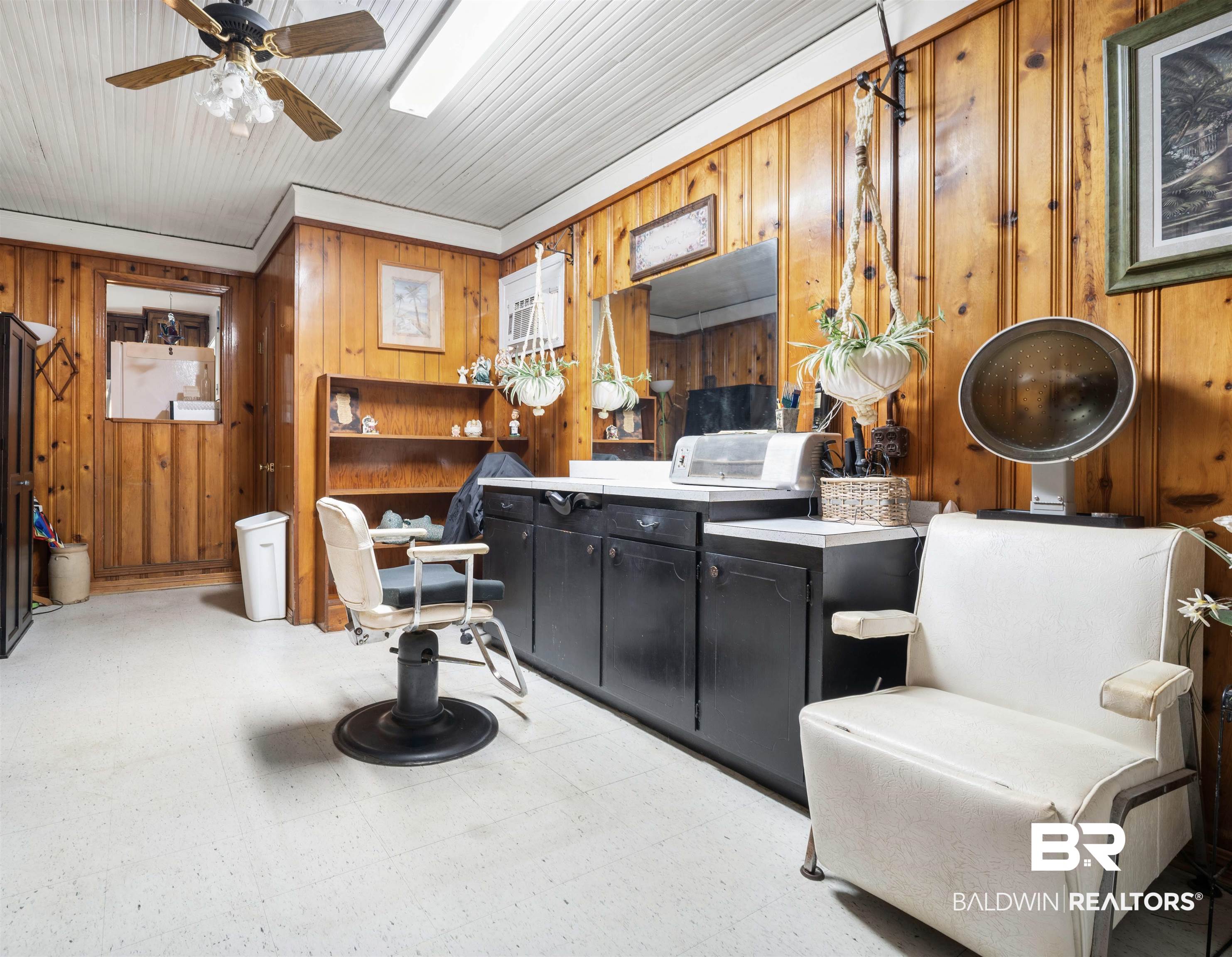 2618 Serigny Drive Mobile, AL 36605 - Photo 21 of 25 Misc room with light flooring, wooden walls, and ceiling fan