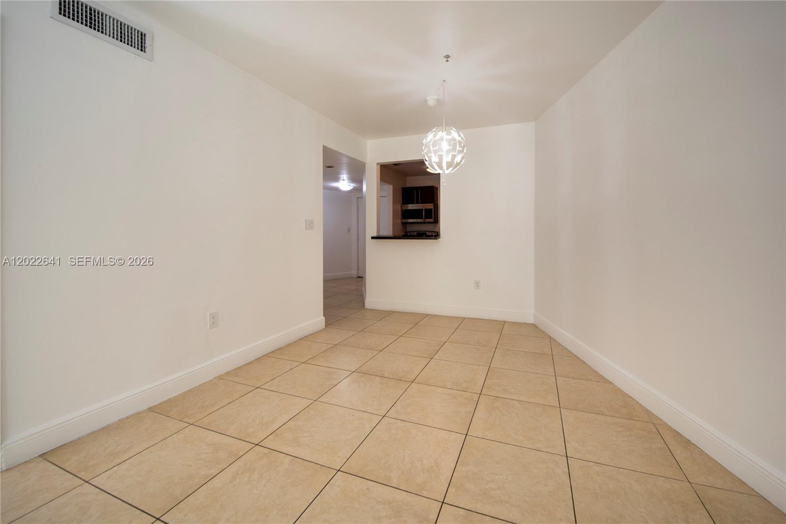 4147 Stirling Road, Unit 105 Dania Beach, FL 33314 - Photo 6 of 16 en empty room with windows