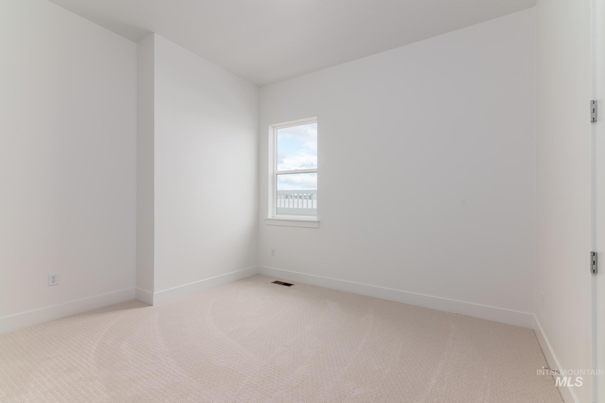 8501 South Country Wind Avenue Meridian, ID 83642 - Photo 20 of 38 Spare room with carpet and baseboards