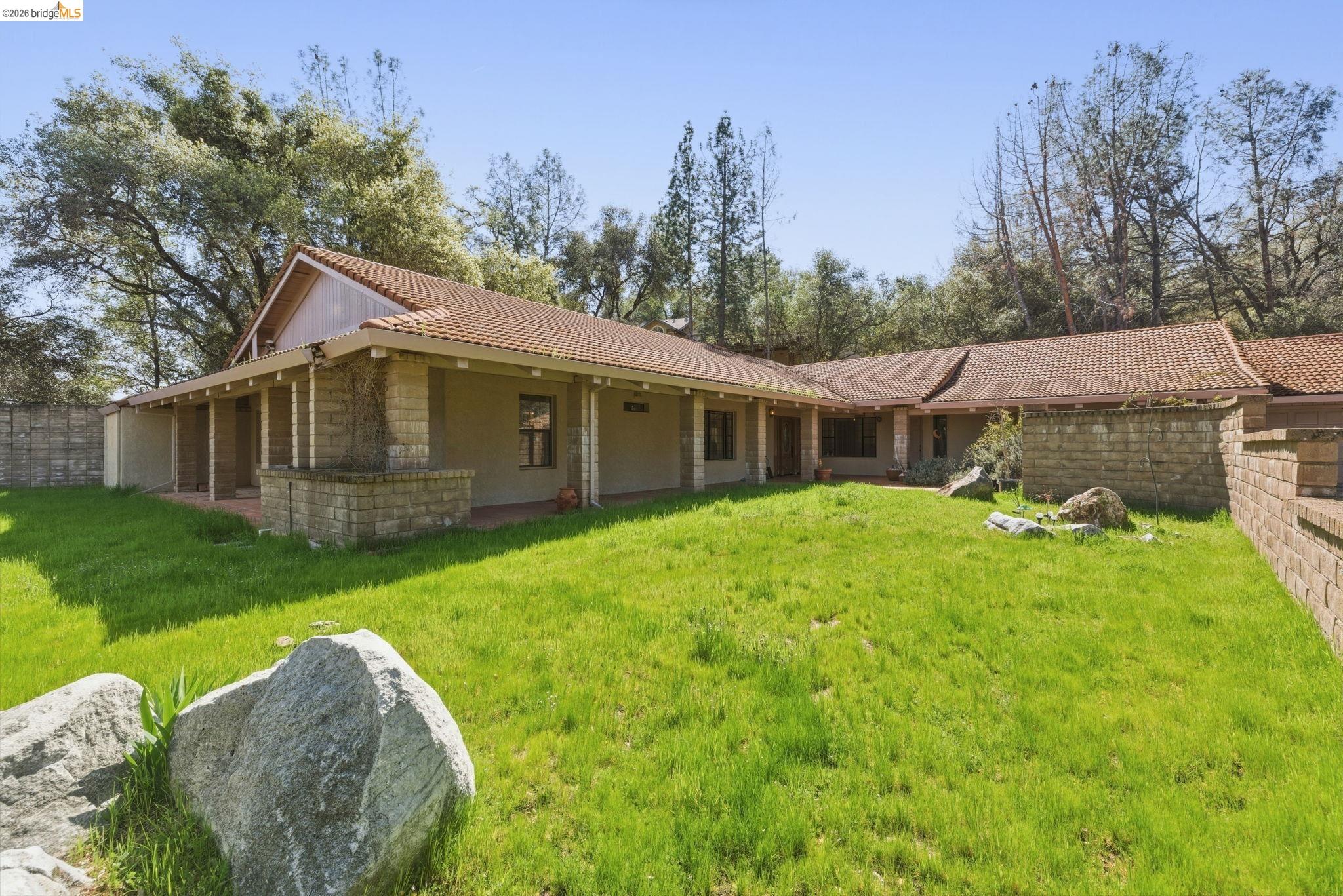 23608 Porcina Way Columbia, CA 95310 - Photo 5 of 51 View of front of house featuring a tiled roof and stucco siding