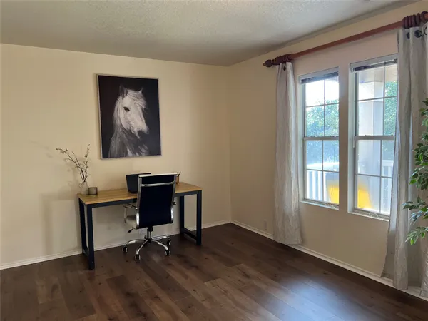 a view of entryway with wooden floor and a window