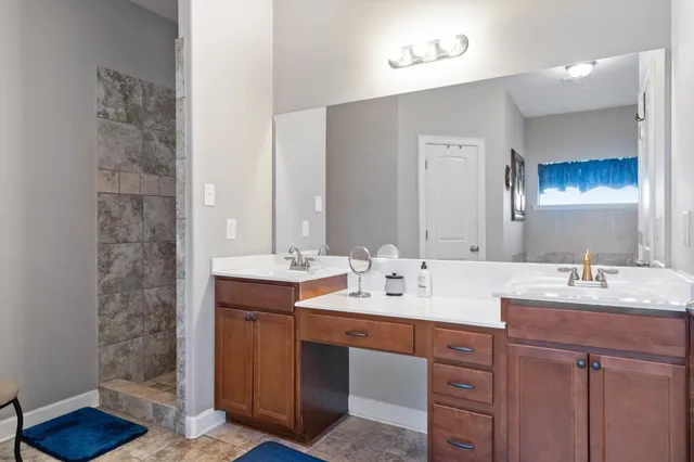 a bedroom with a large bed and a couch