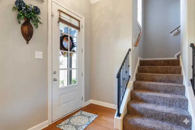 a view of a dining room with furniture and chandelier