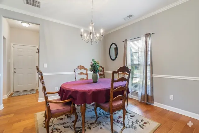a living room with furniture fireplace and flat screen tv