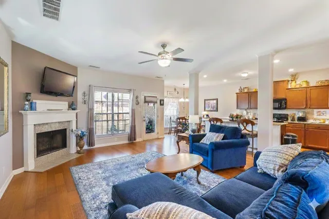 a dining room with furniture and window