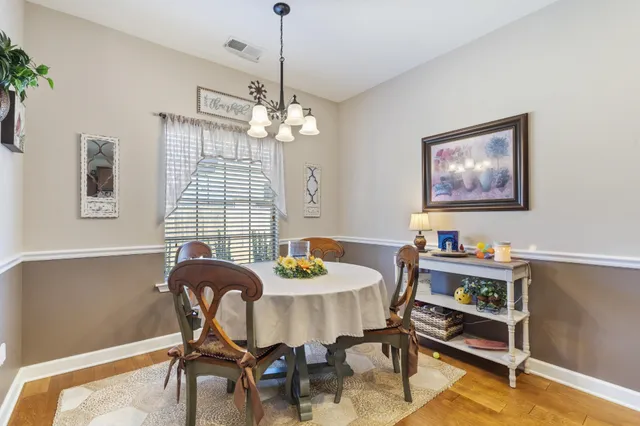 a kitchen with stainless steel appliances granite countertop a sink microwave and cabinets