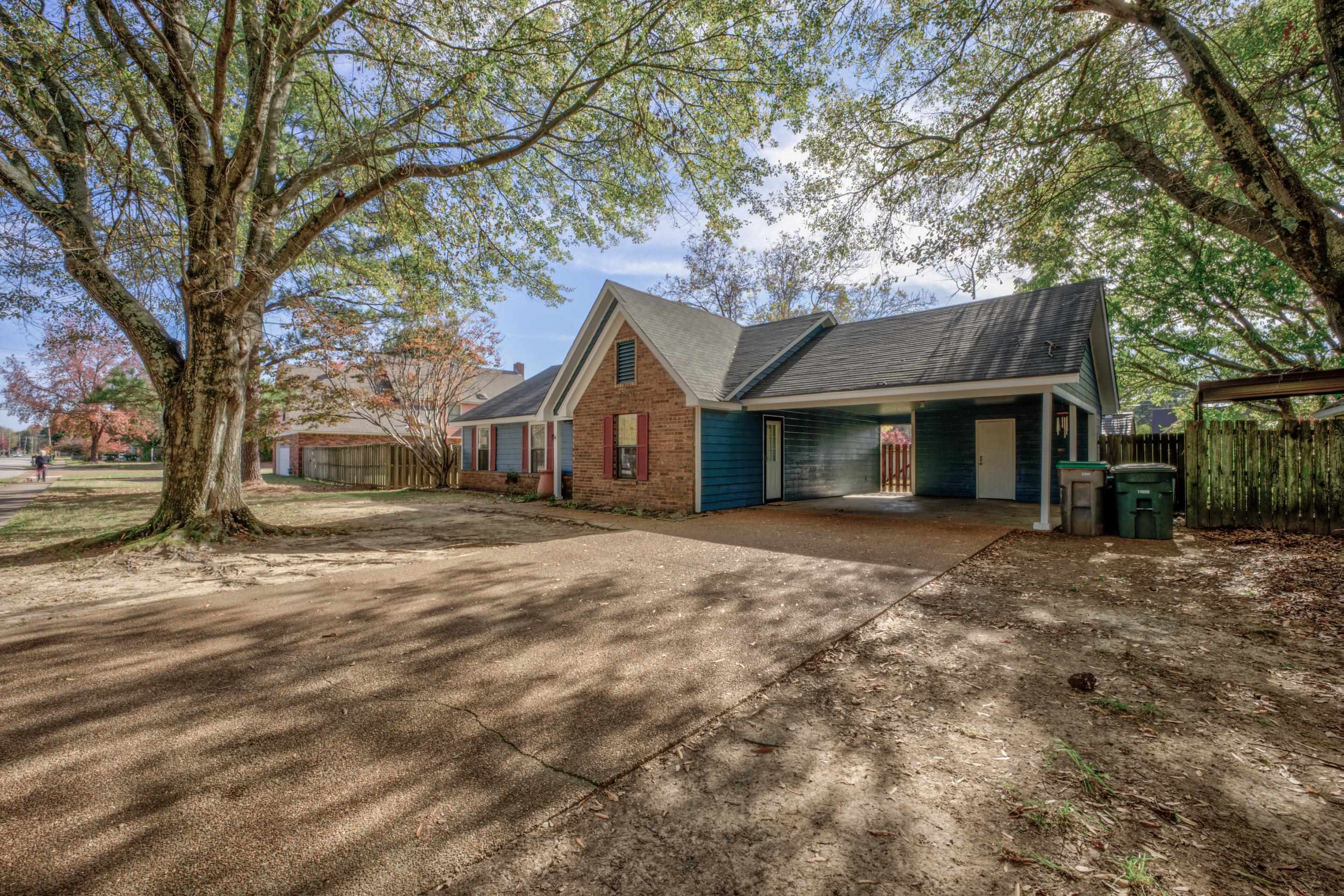 7555 Reese Road Memphis, TN 38133 - Photo 1 of 22 View of side of property featuring a carport