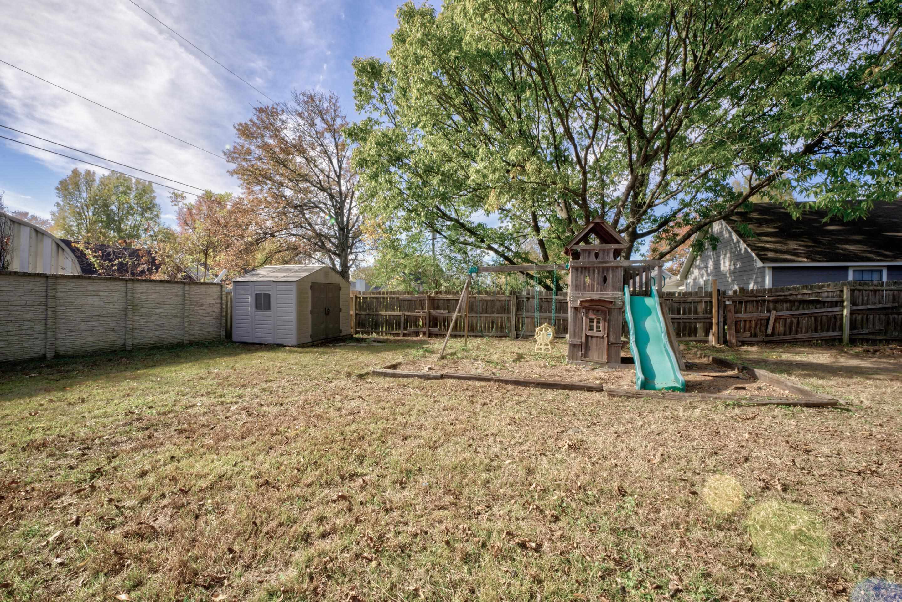 7555 Reese Road Memphis, TN 38133 - Photo 18 of 22 View of yard with a shed and a playground