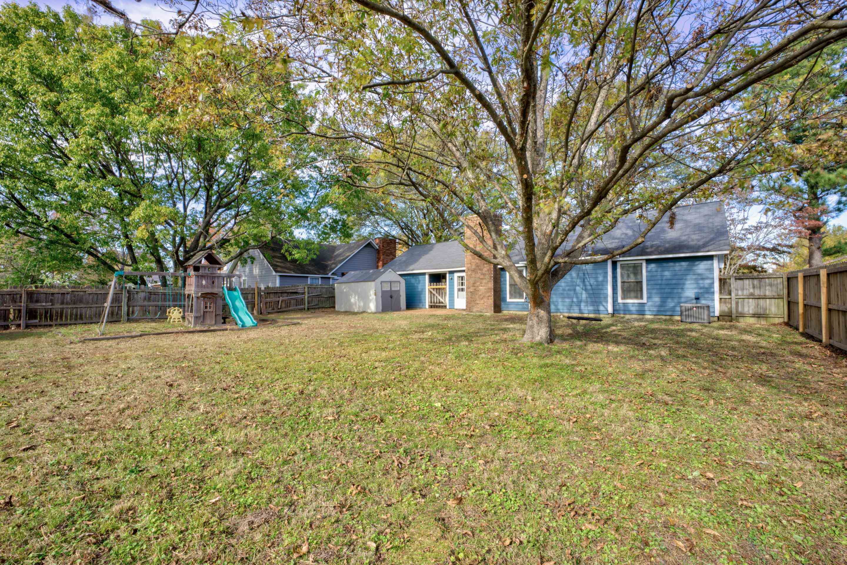 7555 Reese Road Memphis, TN 38133 - Photo 21 of 22 View of yard featuring a playground and a storage shed