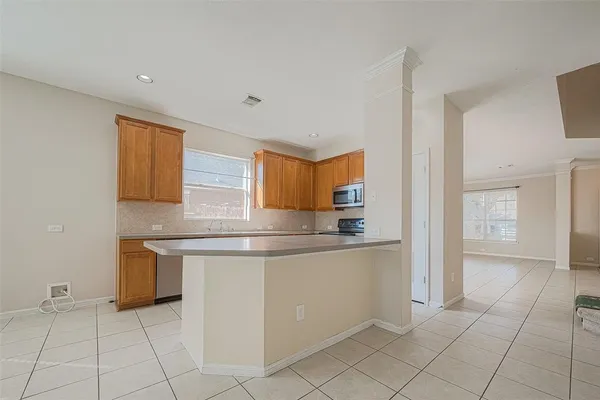 a kitchen with stainless steel appliances granite countertop a sink and cabinets