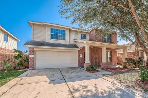 a view of a white house with a outdoor space
