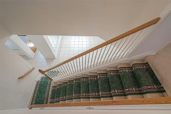 a view of a patio with a table and chairs under an umbrella
